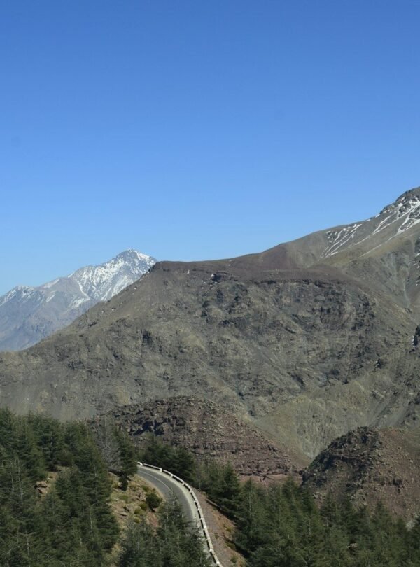 a view of a mountain with a road going through it