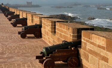 a brick wall with cannons on it