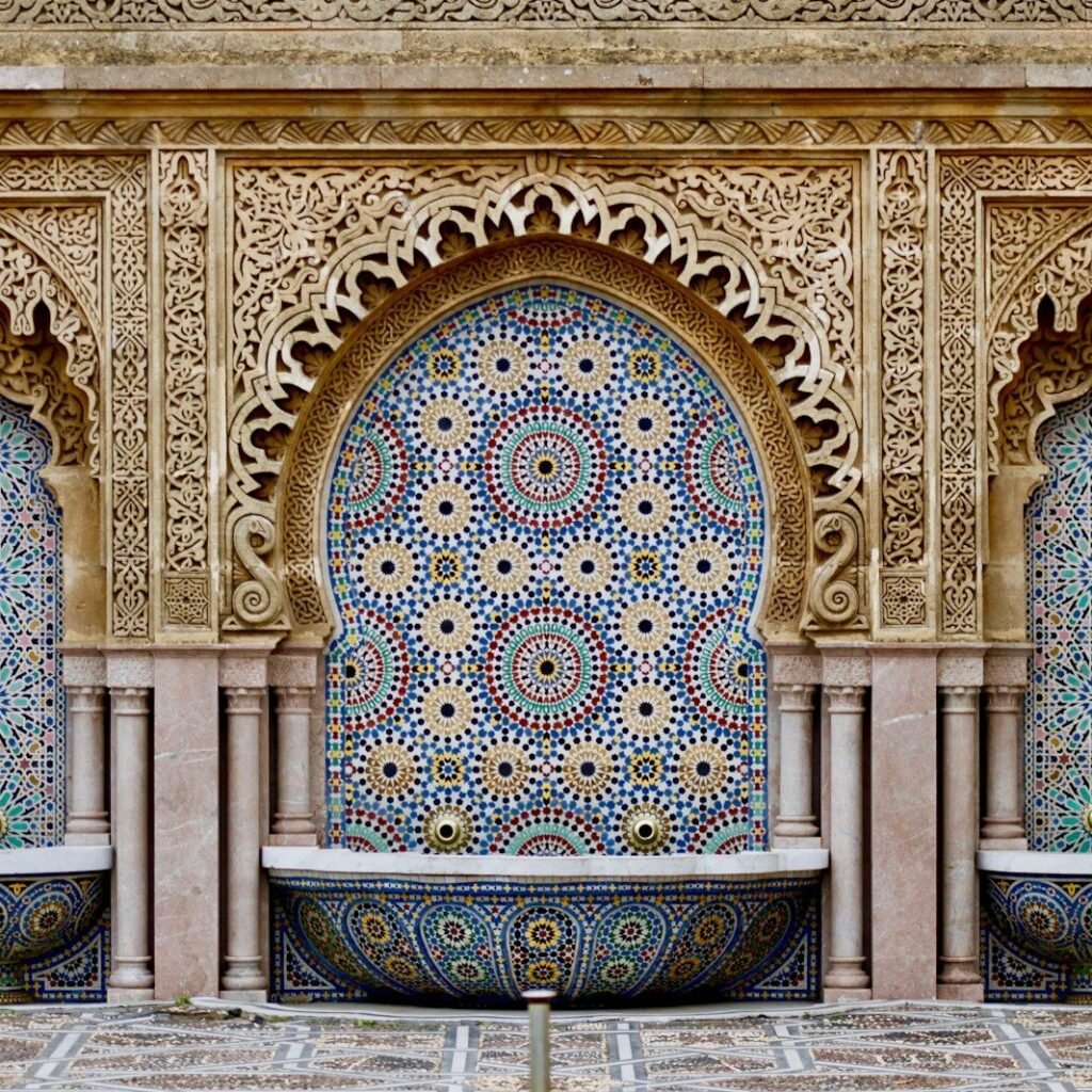 a decorative fountain in the middle of a courtyard