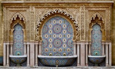 a decorative fountain in the middle of a courtyard